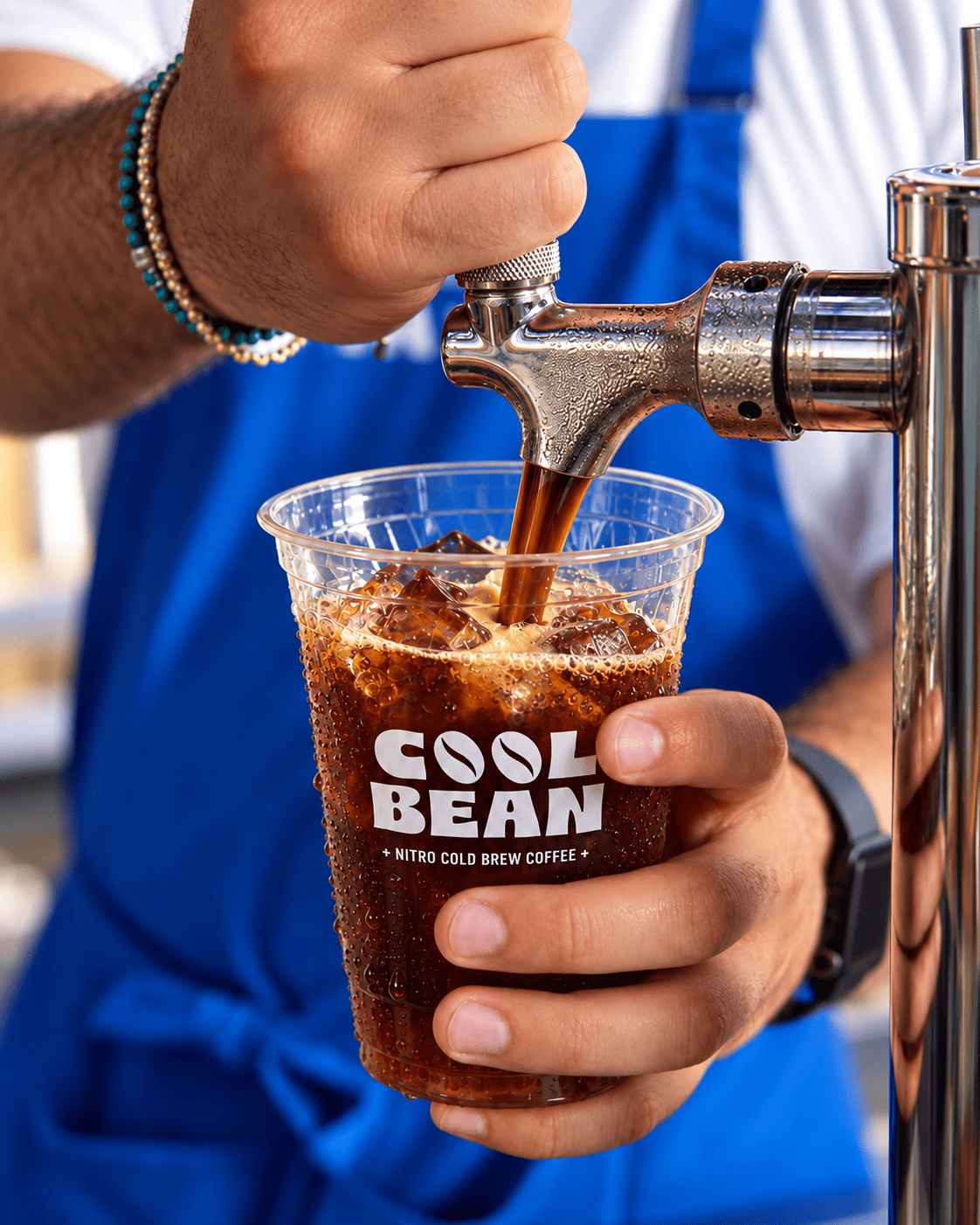Nitro cold brew coffee pouring from the tap at CoolBean NYC